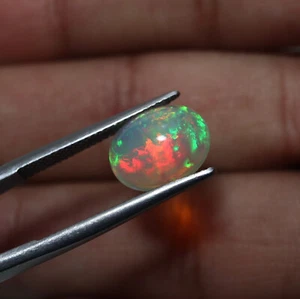 10X12 MM Oval 2.7 Cts Natural AAA Green Red Fire Ethiopian Opal Cabochon - Picture 1 of 10