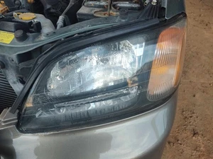 2000-2004 SUBARU LEGACY Headlamp Assembly Left Black Horizontal Bar - Picture 1 of 1
