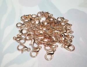 15pz moschettoni  colore oro rosa 12x7mm bijoux - Foto 1 di 1