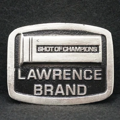 WF01130 *NOS* VINTAGE AÑOS 70 **LAWRENCE SHOT** HEBILLA DE CINTURÓN DE PELTRE MARCA PISTOLA Foto 1 de 2