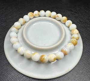 BRACCIALE GIADA NATURALE PERLINE PIETRE MISURA 7MM GIALLO E BIANCO NATURALE,DUE COLORI - Foto 1 di 7