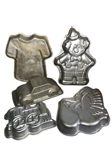Vintage Kuchen Blechform Konvolut von Wilton Auto Clown Tshirt Pelikan Zug 5er Set - Bild 1 von 12