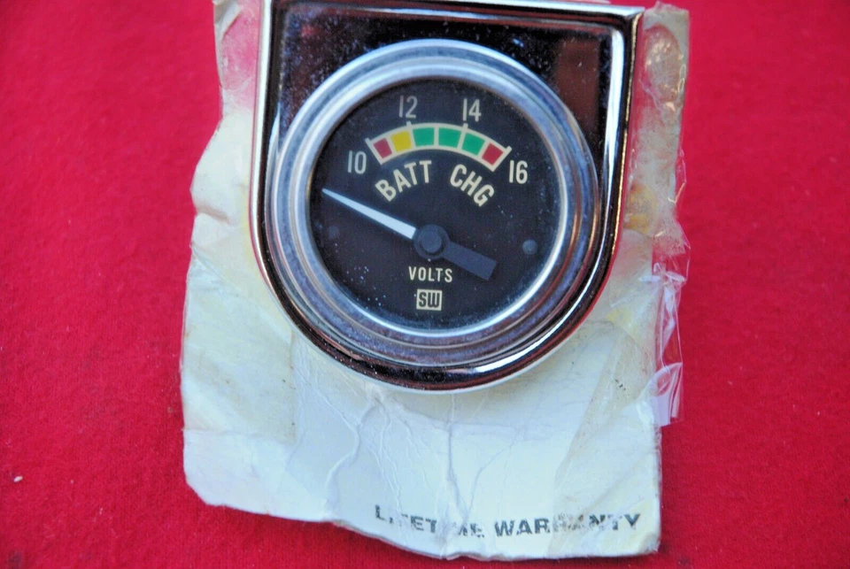 NOS STEWART WARNER 1960s VOLT METER VINTAGE WORKS FINE CORRECT FACE WITH BRACKET - Image 1 of 2