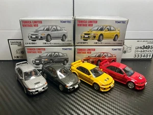 Tomica Limited Vintage 1/64 Mitsubishi Lancer Evolution 4&5 (grau/rot/gelb) - Bild 1 von 7