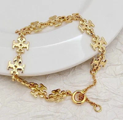 Pulsera Tory diseño logotipo TB en oro amarillo💛 Foto 1 de 4