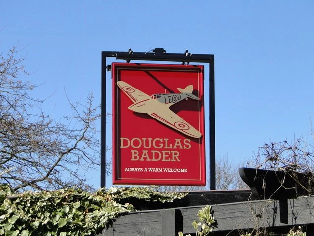 Photo A2 The sign of the 'Douglas Bader' public house Martlesham Heath h c2017 - Image 1 of 1