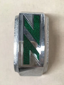 GRILLE BADGE 1965-1982 NISSAN JUNIOR Q140 PICK UP BRAND NEW GENUINE NOS PART - Picture 1 of 6