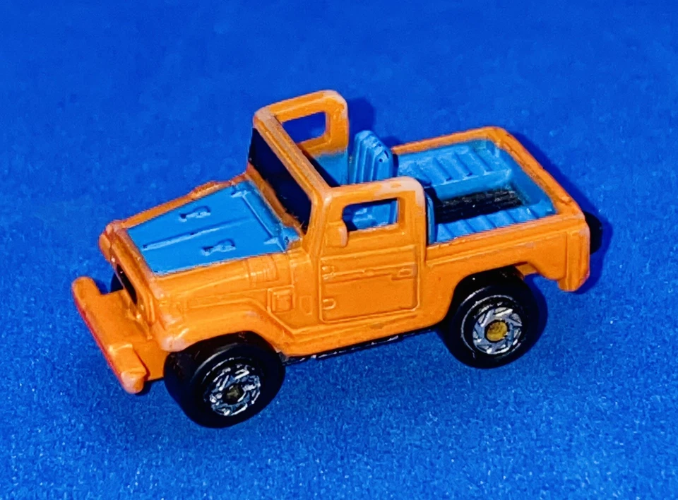 Micro Máquinas TOYOTA LAND CRUISER 1987 Galoob De Colección Naranja y Azul Foto 1 de 4