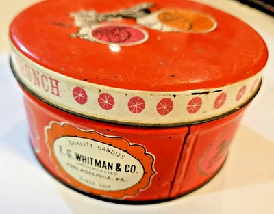 Vintage E.G. Whitman & Co. Estanho redondo "Peanut Crunch" (laranja e rosa) - Imagem 1 de 4
