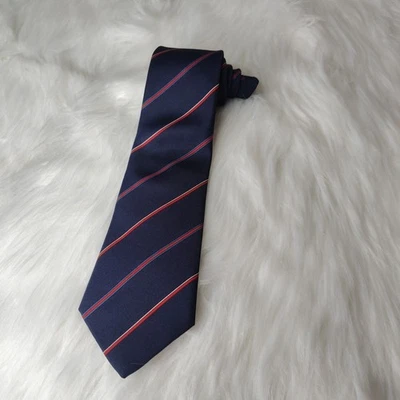 Corbata vintage de seda azul marino Yves Saint Laurent con rayas salmón y topo.  Foto 1 de 4