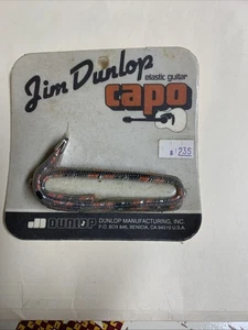 Jim Dunlop 71 5D Curvo/Piatto Acciaio Corda Elastico Capotasto Chitarra Nuovo Sigillato - Foto 1 di 2
