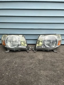 Conjunto de faros Toyota Tacoma OEM 2011 2010 2009 2008 2006 05 paso del conductor - Imagen 1 de 24