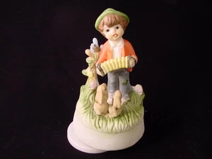 Vintage Porcelain Music Box featuring a Boy a Blue Bird and a Rabbit - Picture 1 of 3