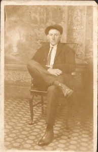 Postcard RPPC Man sitting Cross Legged Chair Fedora Vintage PC563 - Picture 1 of 2