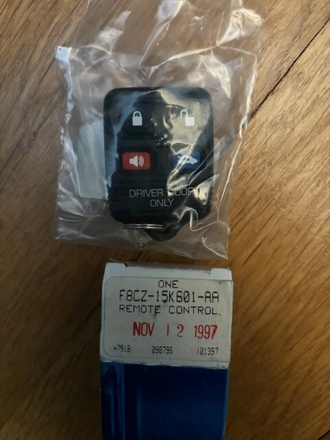 NOS 1998 1999 Ford Escort Remote Key Button Fab F8CZ-15K601-AA - Image 1 of 1