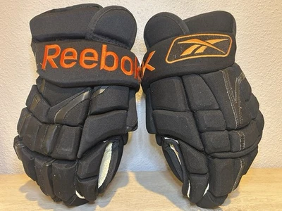 Guantes de hockey sobre hielo Reebok 10KN NHL Pro Stock talla 14” 36 cm negro/naranja usados en excelente estado Foto 1 de 4