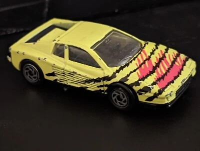 AWESOME & FUN FERRARI TESTAROSA 1:59 SCALE BY MATCHBOX NEON GREEN/BLACK/RED - Image 1 of 4