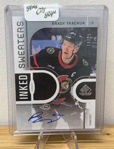 BRADY TKACHUK 2024-25 SP GAME USED IS-BT INKED SWEATERS PATCH AUTO /35 - Bild 1 von 2