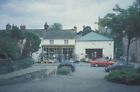 Photo 6x4 Ironmonger and filling station in Montgomery just below the cas c1996
