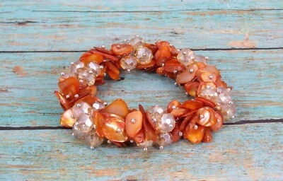 Pulsera elástica naranja oscuro con cáscara y cuentas de vidrio naranja claro - NUEVA Foto 1 de 4