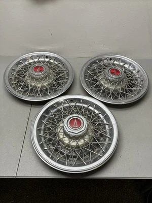 3 OEM 1977-81 Pontiac Bonneville Catalina 15" radios de alambre tapacubos cubierta de rueda Foto 1 de 4