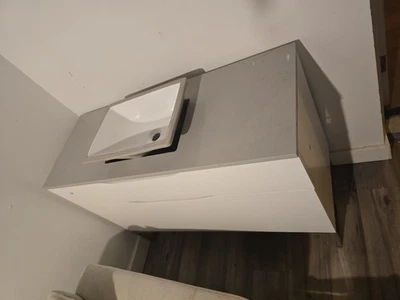 This stylish unit features a clean white cabinet base paired with a light grey  - Image 1 of 4