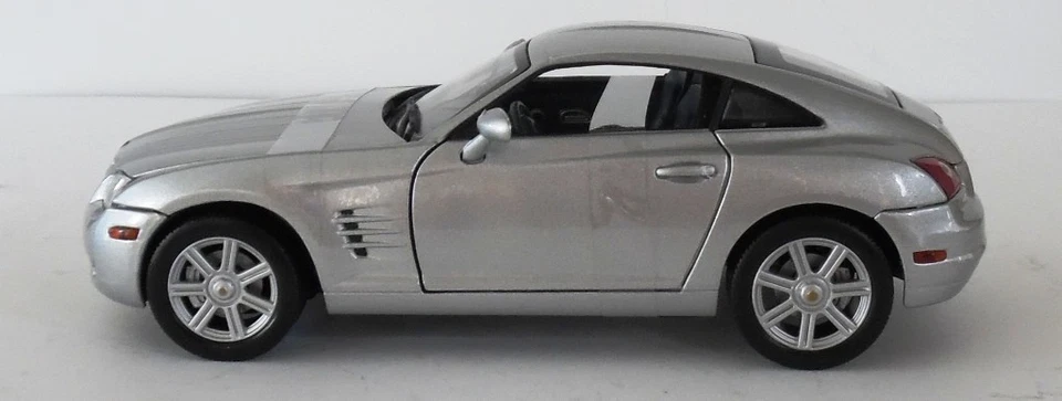 Diecast Silver 2003 Chrysler Crossfire 1:18 Solido New - Image 1 of 4
