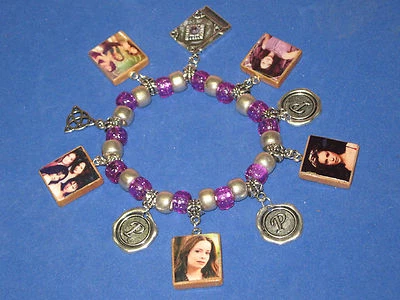 PULSERA "LOS ENCANTADOS" - CON ENCANTO - CON CUENTAS - PÚRPURA Y PLATA Foto 1 de 4