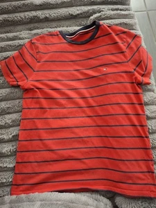 This stylish red striped kids' t-shirt from Tommy Hilfiger offers comfort. - Picture 1 of 4
