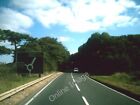 Photo 6x4 Approaching Asthall Barrow roundabout On the A40. The roundabou c2009