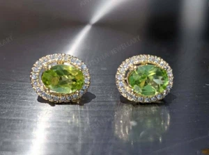4Ct Simulated Oval Cut Green Peridot Women' Stud Earrings 925 Silver Gold Plated - Picture 1 of 9