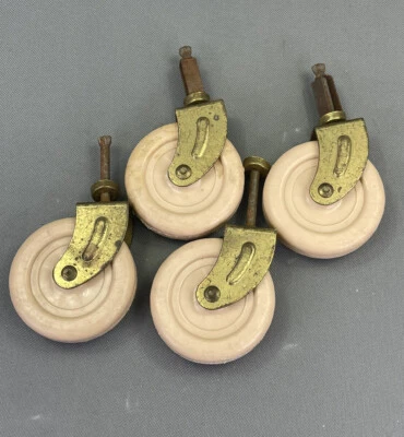 4 vintage plastic furniture casters - 1.5” pin & 2.75" diameter beige  wheels - Image 1 of 4