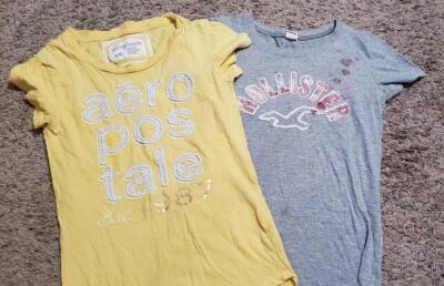 LOTE DE 2! Camiseta para niña talla mediana AEROPOSTALE camiseta amarilla y gris HOLLISTER (M) Foto 1 de 4