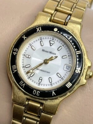 Reloj Hugo Maxx Dama Cuarzo Tono Amarillo Chapado en Oro 18K Fecha Ventana Batería Nueva Foto 1 de 4