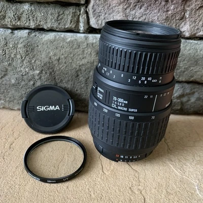 Sigma 70-300MM 1:4-5.6 DL Macro Super Zoom Lens w/ ProMaster 58mm UV Filter - Image 1 of 4