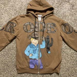 Sudadera con Capucha King of the Hill Vaquero Bobby Rodeo Cremallera Talla M - Exclusiva BoxLunch - Imagen 1 de 8