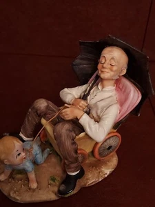 VINTAGE NORLEANS JAPAN FIGURINE OLD MAN IN BABY STROLLER BISQUE PORCELAIN - Picture 1 of 10