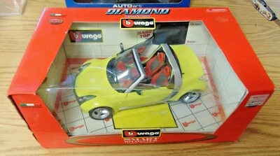 Burago 1/18 MCC Smart Roadster diecast yellow Code 34099 Removable Top Diamond - Image 1 of 3