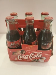 Coca cola Theme bottles, multiple year mixed six pack  - Picture 1 of 5