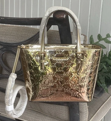 MICHAEL KORS JET TRAVEL XS ZIP CROSSBODY TOTE BAG MK EMBOSSED PALE GOLD METALLIC - Image 1 of 4