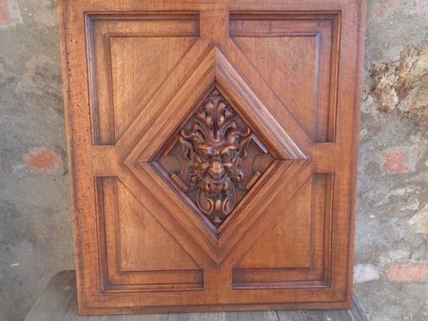 antique french carved wood panel with a devil face Cover