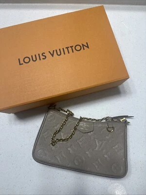 Louis Vuitton Empreinte Cuero LV Monograma Foto 1 de 4