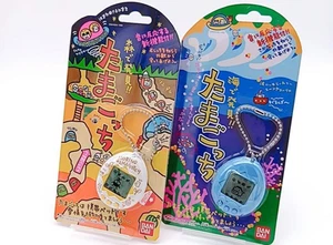 Juego de 2 Bandai Tamagotchi Mori de Hakken Blanco Umi de Hakken Azul - Imagen 1 de 6