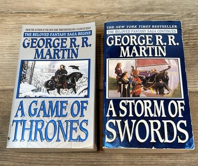 A Game Of Thrones-19 TH  & Storm Of Swords-1 ST George R. R. Martin Paperback - Image 1 of 4