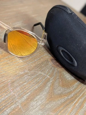 Gafas de sol Oakley redondas lentes doradas de iridio marco transparente retro modernas EE. UU. raras Foto 1 de 4