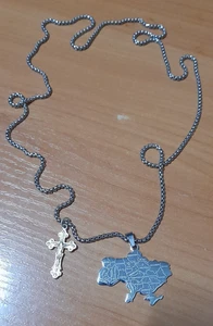 A cross and a pendant with a map of Ukraine on a Ukrainian Army soldier's chain. - Picture 1 of 6