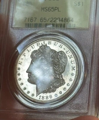 1886 MORGAN SILVER DOLLAR 🇺🇸PCGS MS-65 PL 🎖️$1 PROOF-LIKE OGH COIN - Image 1 of 4
