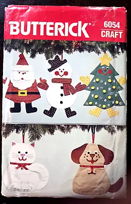 Christmas Stockings Butterick Craft Pattern 6054  Santa Dog Cat Snowman UNCUT - Image 1 of 4