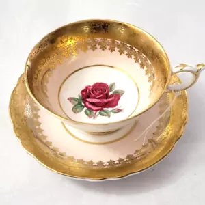 Taza y platillo de té dorado Paragon England rosa roja sobre fondo rosa 286 - Imagen 1 de 8