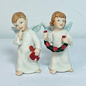 2 Bing & Grondahl Annual Little Angels: Mädchen mit Blumenrebe 2006, Junge mit Herz 2005 - Bild 1 von 6